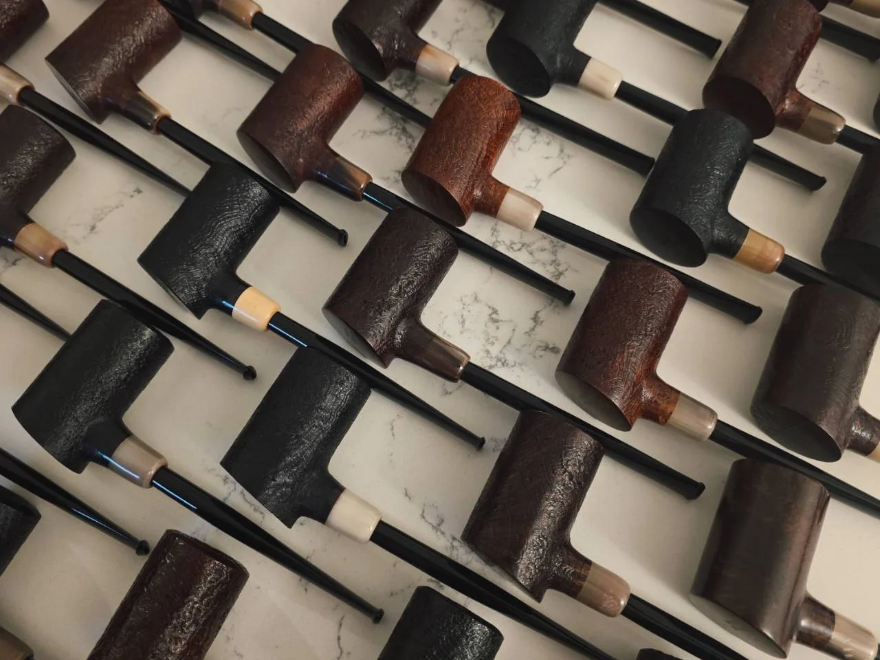 Rows of MBSD Briars ReDon sandblasted poker pipes